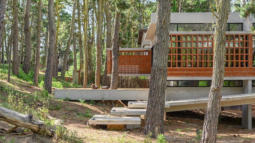 residence of exposed concrete and brick adopts 1970s chalet typology in buenos aires forest