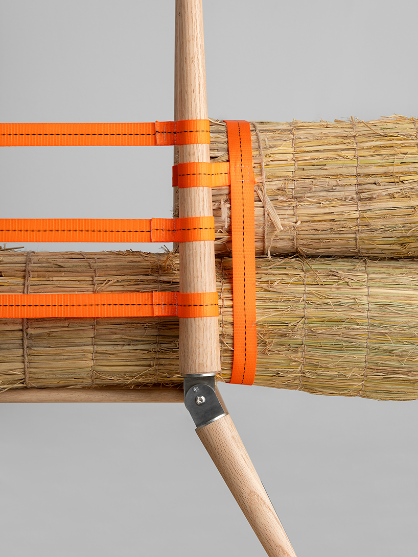 rice straw bundles atop wooden A-frame craft jige-inspired chair by sukchulmok 