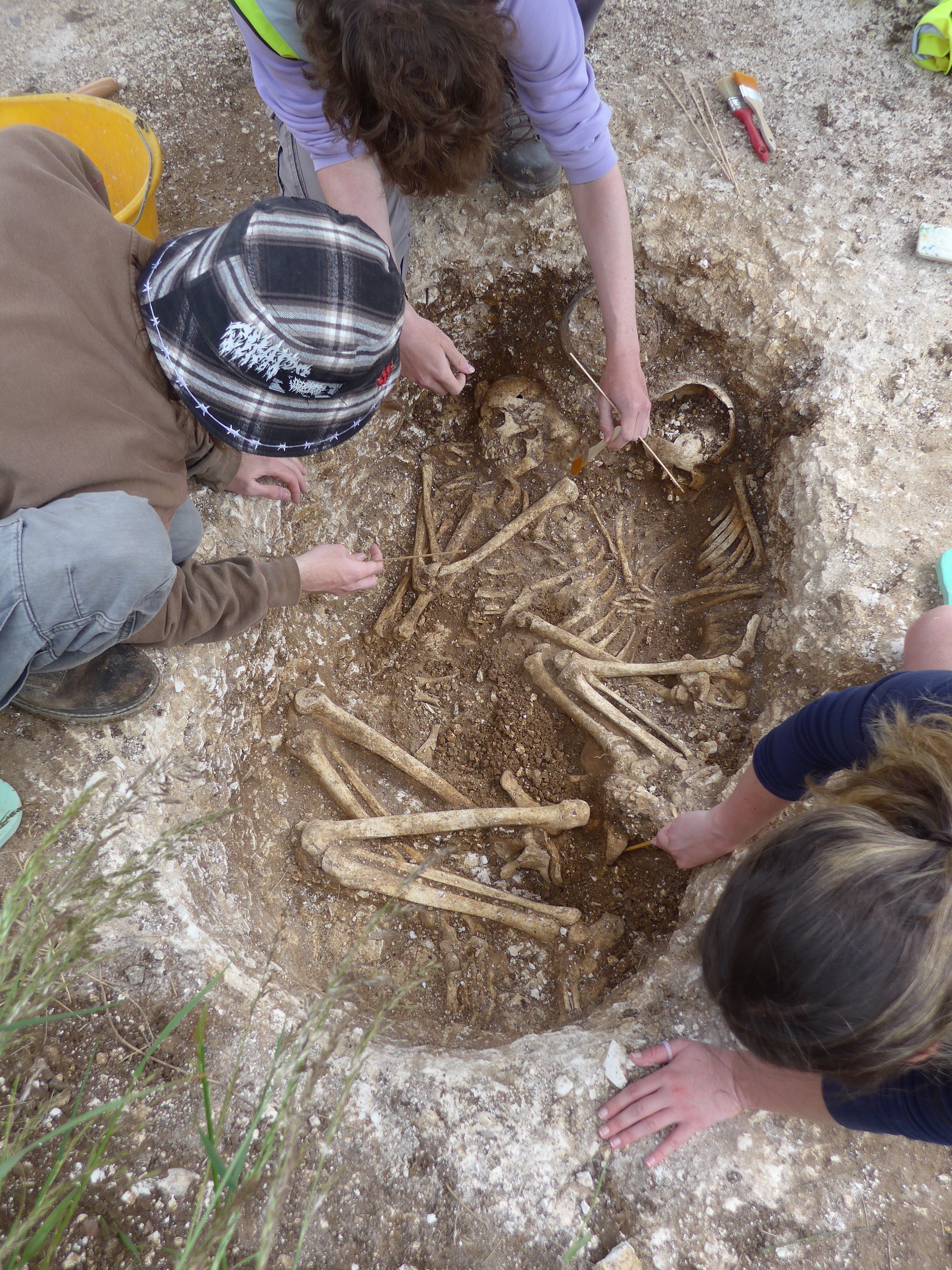 Archaeologists work on the burial site