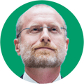 Smiling bearded man with glasses