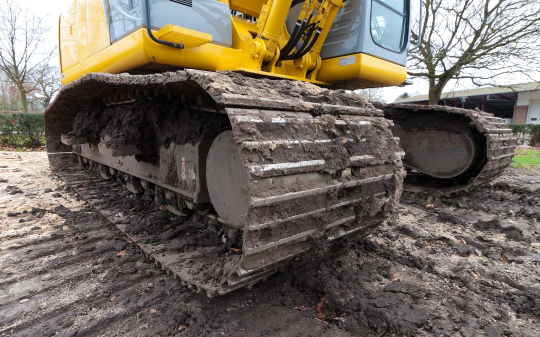 wide angle view of the tracks of an excavator