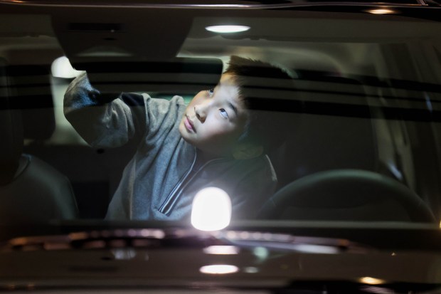 Noah Jen, 9, of Santa Clara, explores a 2025 Sportage Hybrid Kia Sportage SX-Prestige AWD on display during the 2025 Silicon Valley Auto Show at the Santa Clara Convention Center in Santa Clara, Calif., Friday, Feb. 21, 2025. Attendees explored the latest vehicles from 17 manufacturers, the chance for test drives, and a demo of a TOboR Home Dog. The show runs from Friday, Feb. 21, through Sunday, Feb. 23. (Ray Chavez/Bay Area News Group)