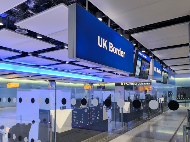 A UK border sign at the arrivals hall in London's Heathrow Airport.