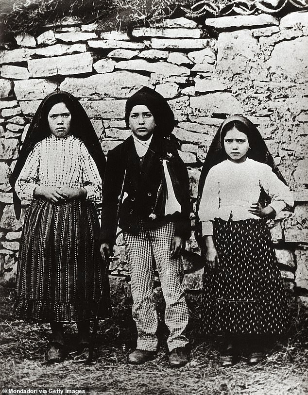 Just 33 years later, in 1917, the Virgin Mary, known as Our Lady of Fatima, reportedly appeared to three shepherd children in Portugal, delivering urgent warnings about the future of humanity if it did not repent. L-R: Lucia dos Santos, Francisco Marto and Jacinta Marto