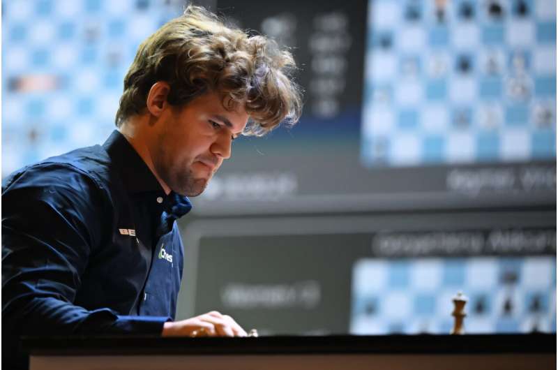 Norwegian grandmaster Magnus Carlsen, pictured during a 2024 match, took on a team of 143,000 opponents. Norwegian grandmaster Magnus Carlsen, pictured during a 2024 match, took on a team of 143,000 opponents
