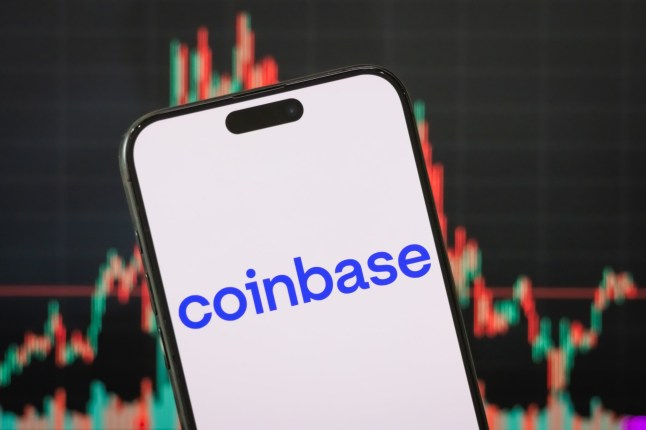 CHONGQING, CHINA - MAY 06: In this photo illustration, the logo of Coinbase Global, Inc. is displayed on a smartphone screen, with the company's latest stock market chart in the background, reflecting investor sentiment and recent trading activity, on May 06, 2025, in Chongqing, China. Coinbase is an American cryptocurrency exchange platform that enables users to buy, sell, and store digital assets such as Bitcoin and Ethereum. (Photo illustration by Cheng Xin/Getty Images)