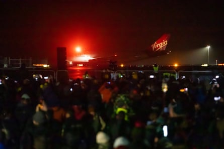 Members of the public watch as Cosmic Girl, the aircraft, taxis before take-off.