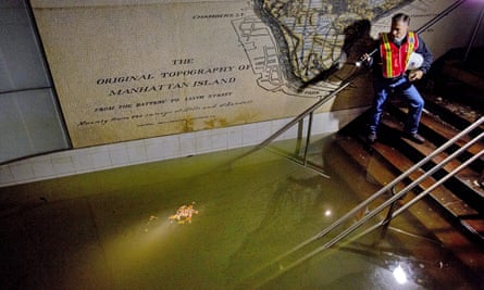 In 2012, Joseph Leader, Metropolitan Transportation Authority vice president and chief maintenance officer, shines a flashlight on standing water inside the South Ferry #1 subway train station in New York in the wake of Superstorm Sandy.