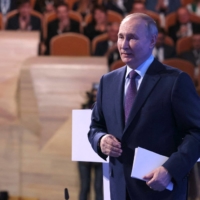 Putin at an event on Thursday | SPUTNIK / VIA AFP-JIJI