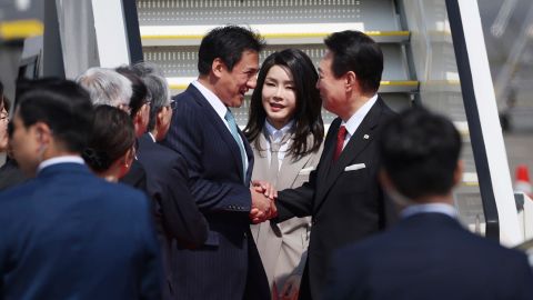 South Korean President Yoon Suk Yeol arrive at Haneda International Airport with his wife Kim Keon-hee in Tokyo on March 16, 2023. 