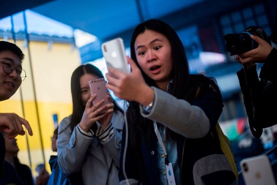 Woman checking Iphone