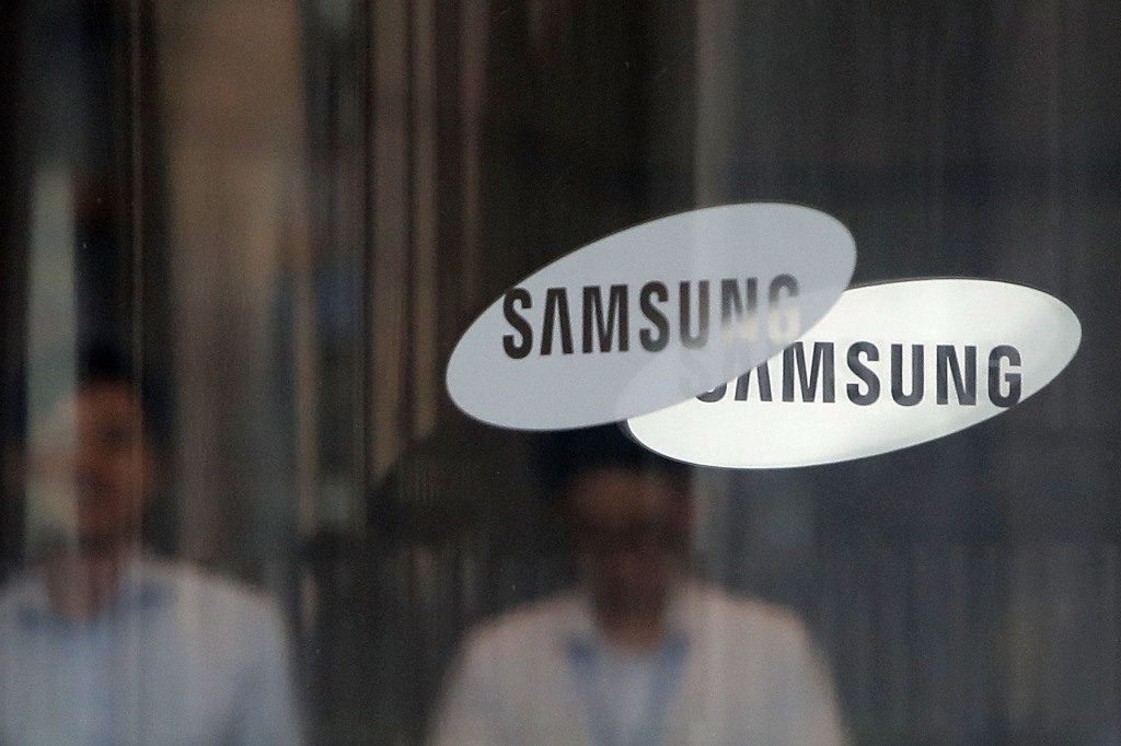 A pair of Samsung logos on a glass door at Samsung's headquarters in South Korea.