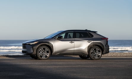 The bZ4X electric car pictured beside a beach 