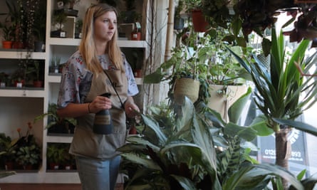 Hope Dean looks at some of her plants in the Wild Roots shop