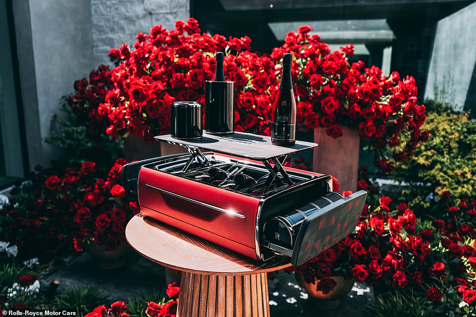 The car's owner not only commissioned the vehicle but also a unique Rolls-Royce champagne chest and cooler, which is made from black anodised aluminium and carbon fibre (pictured)