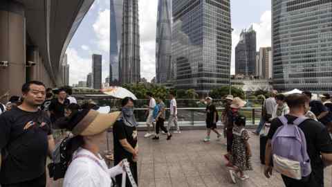 Pedestrians in Shanghai’s financial district