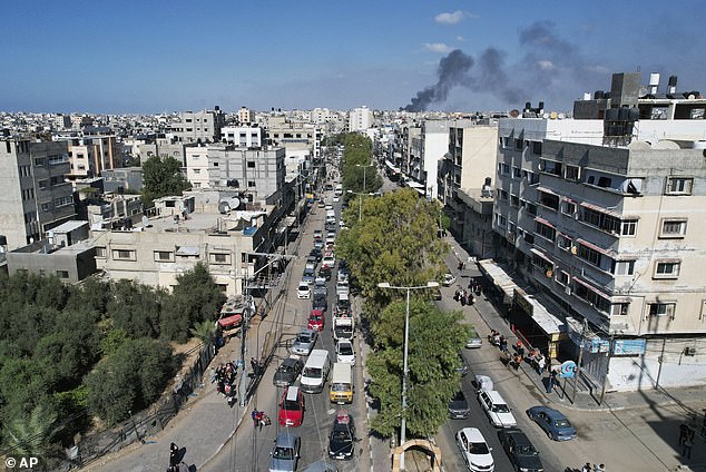 Families in cars, trucks and donkey carts packed with blankets and possessions streamed down a main road out of Gaza City