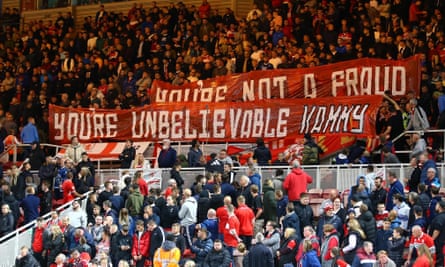 Middlesbrough fans hold up banners showing their support for Chris Kamara in 2022