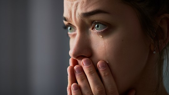 A woman crying.