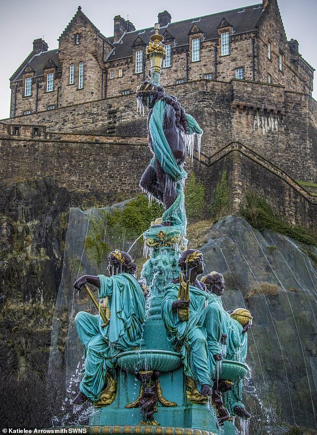 Advice was issued as a wave of cold weather swept the UK. Pictured: Ross Fountain in Edinburgh's Princes Street Gardens is frozen as temperatures plunged