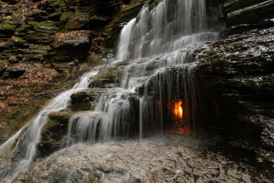 Flame under a waterfall