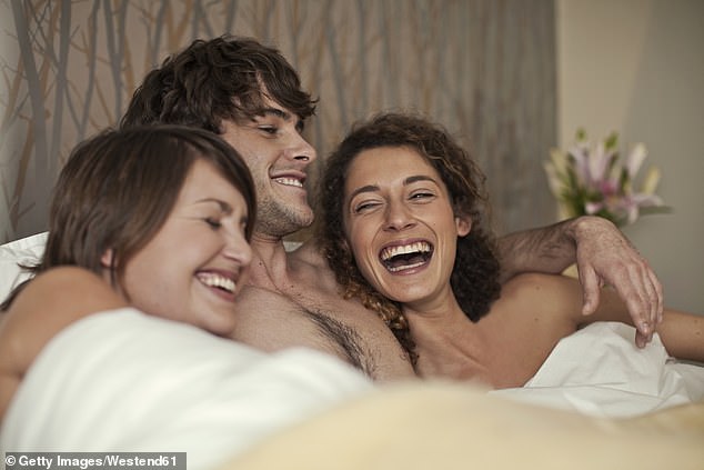 Researchers say that some people are attracted to the 'energy' or 'third force' between members of an existing couple rather than the individual members themselves (stock image)