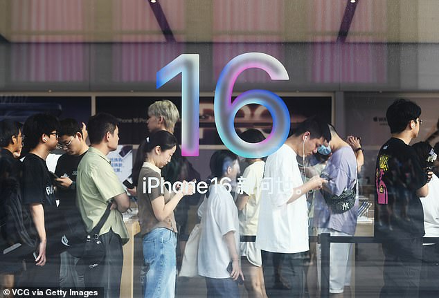 HANGZHOU, CHINA: Customers wait in line at an Apple flagship store during the first day of sale of the iPhone 16 series smartphones on September 20, 2024