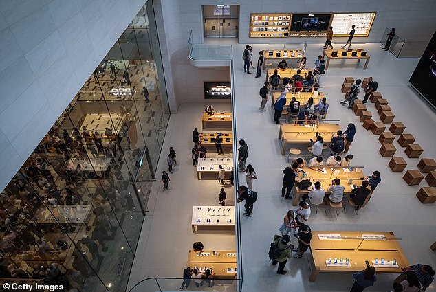 KUALA LUMPUR, MALAYSIA: Customers seen inside and outside the Apple shop for the launch of the iPhone 16