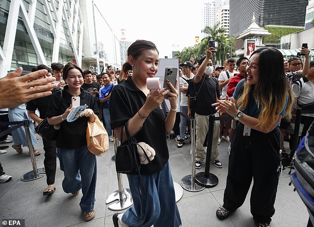 BANGKOK, THAILAND: Customers are greeted with much fanfare as Apple Store Bangkok welcomes queuers