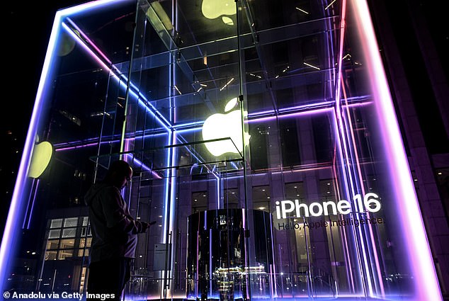 NEW YORK, USA: Apple's iconic Fifth Avenue store is illuminated in the early hours of Friday as sales prepare to kick off