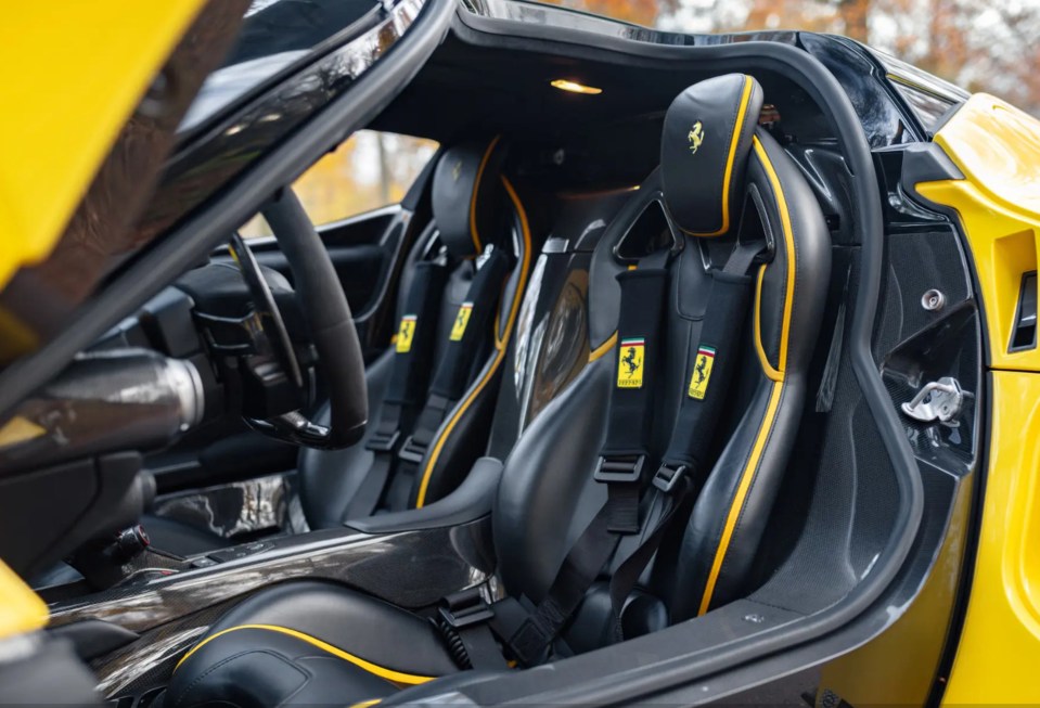 It has black seats are trimmed in yellow