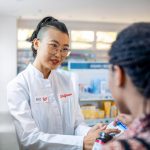 Female pharmacist helping a customer