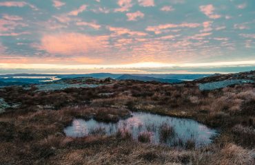 sunset from the top of a high mountain in norway