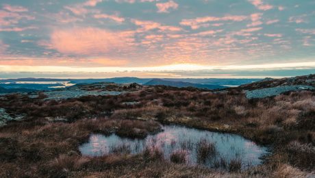 sunset from the top of a high mountain in norway