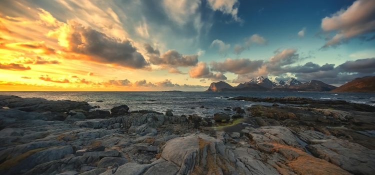 seascape with a rocky shore and clouds in the sky