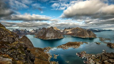 landscape photography of mountains surrounded by water