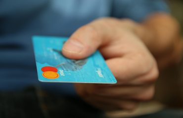 person holding debit card