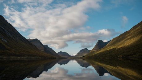 view of fjords and sky reflecting in the water