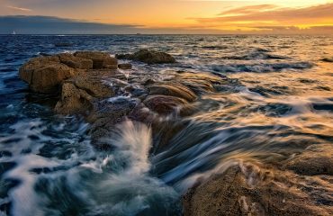 view of a sea at sunset