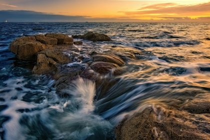 view of a sea at sunset