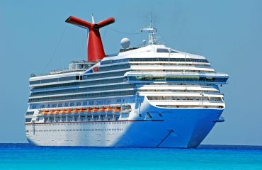 white red and orange cruiser ship on body of water during daytime