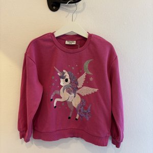 Rosa tröja med unicornmotiv stl 110/116