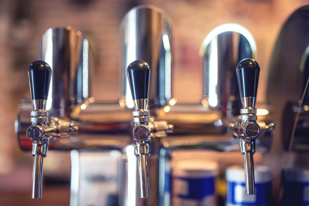 Beer tap at restaurant, bar or pub. Close-up details of beer dra