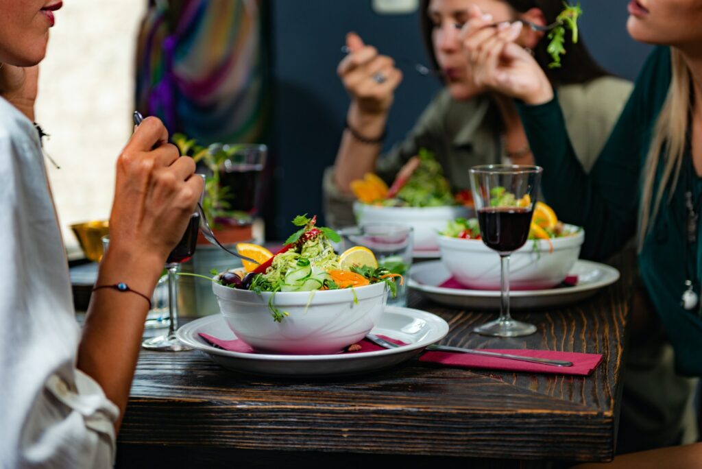 Vegetarian Restaurant. Young Woman In A Vegetarian Restaurant