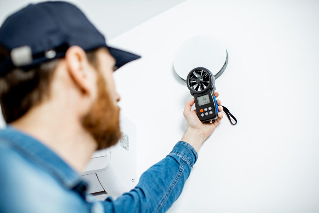Handyman checking of air ventilation