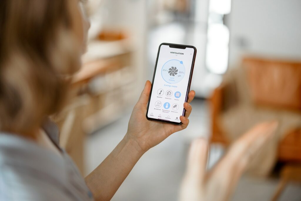 Smartphone with launched application for ventilation adjustment