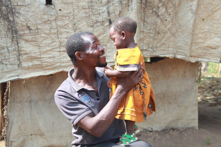 Men approach in Kyangwali refugee settlement