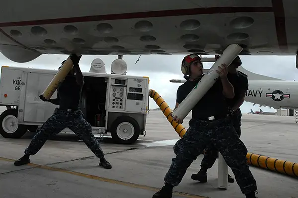 Sonobuoys are loaded into the wings of an aircraft.