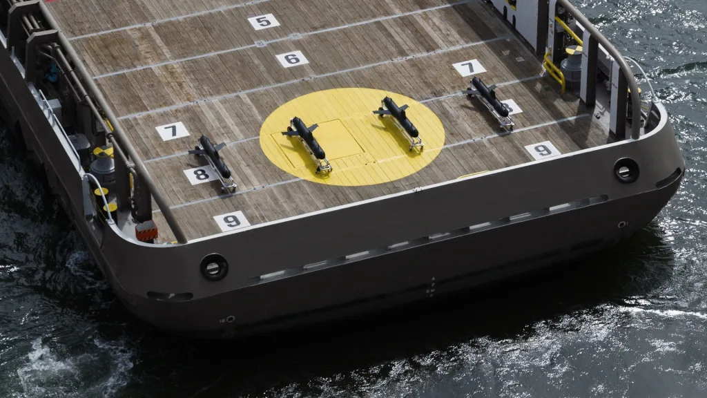 SG-1 Fathom autonomous gliders arrange on the back of a ship.