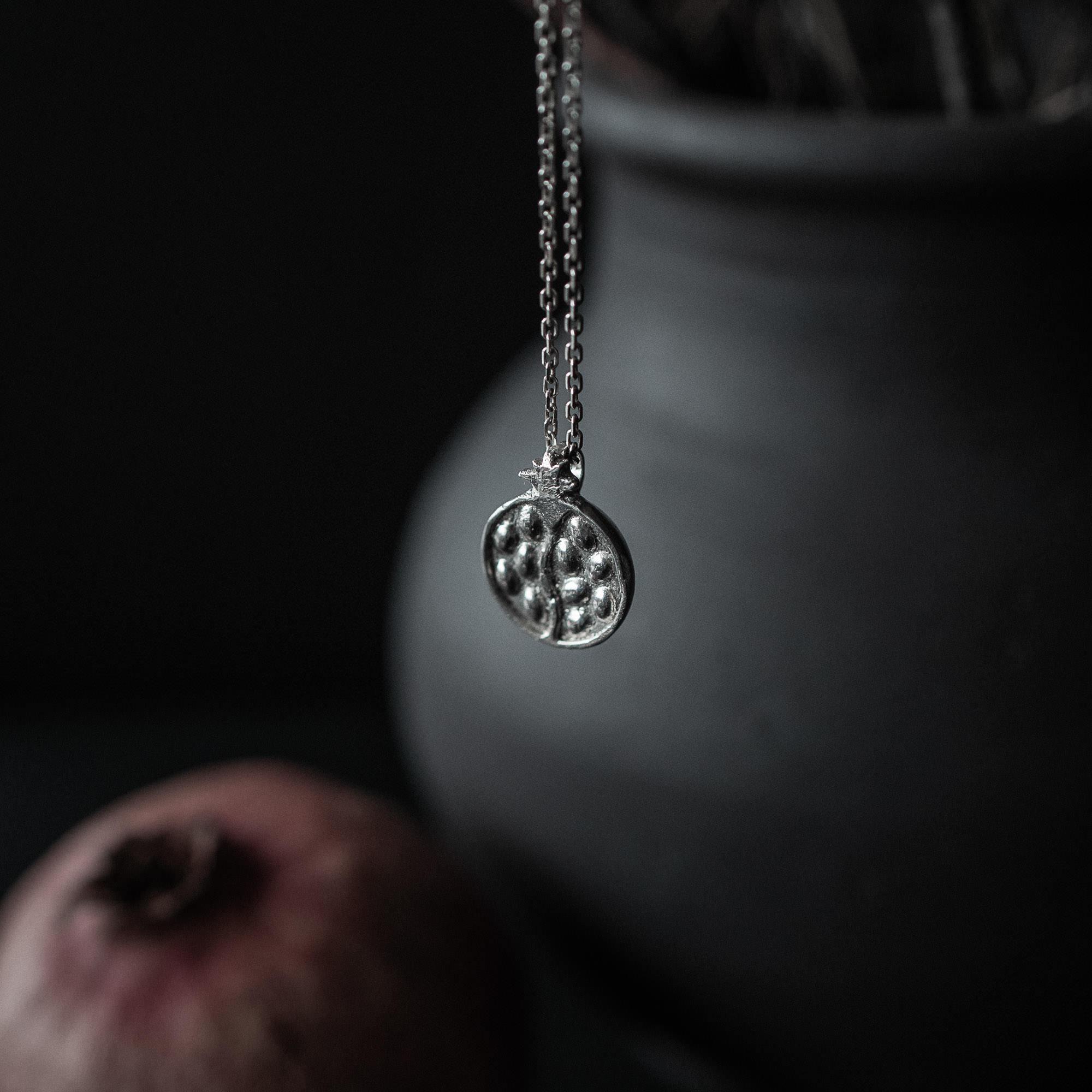 Silver necklace and pendant inspired by the mythology of Persephone and Hades